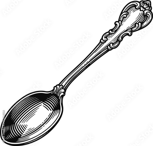 Ornate vintage silver spoon engraving with detailed floral and scroll handle design