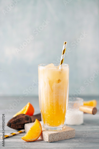 Homemade Cold Dirty Soda with  Coconut Cream, Ice and Orange. Alcohol free mocktail