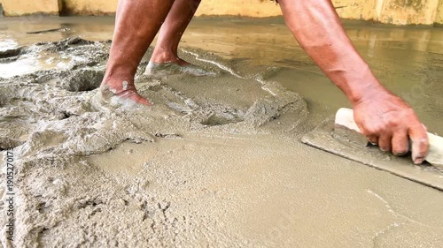 Close Up of Mason Working with Wet Cement