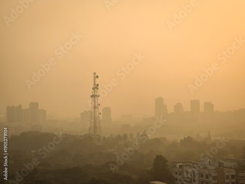 Fotografi Heavy polluted atmosphere in the city, blurred sky dark with air pollution smoke cloud dust mist for background, problem in atmosphere