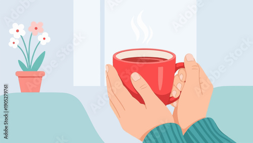Person's hands cradling a steaming red mug of warm beverage next to potted flowers