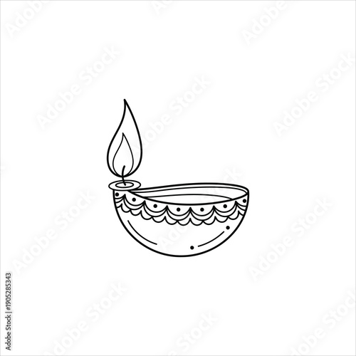 A traditional indian diya lamp with a lit wick