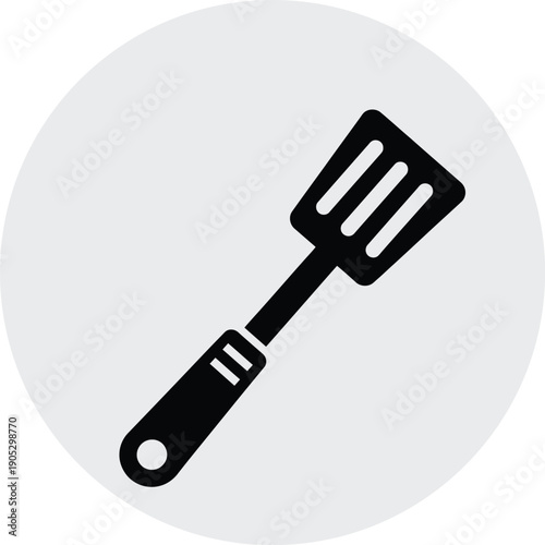 Black silhouette of a spatula on a light gray background