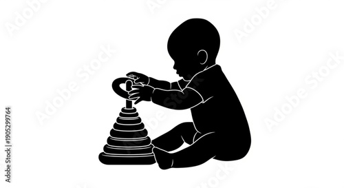 A baby playing with a stack of rings on a white surface viewed from the side