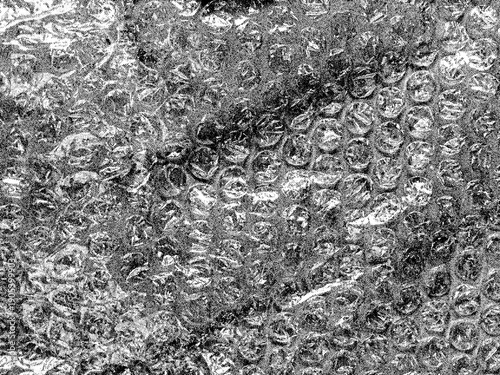 Photos Monochrome bubble wrap texture with high contrast and detailed air bubbles for abstract background and grunge design overlays