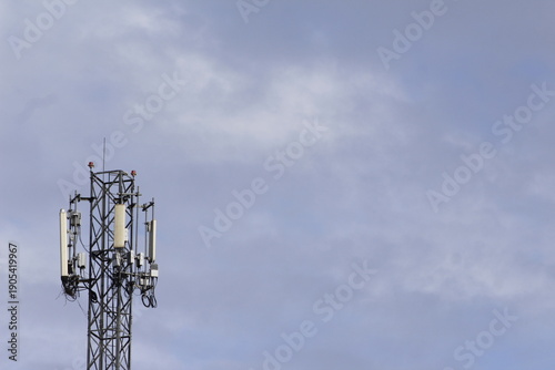 Cell Phone Tower Against a Cloudy Sky
