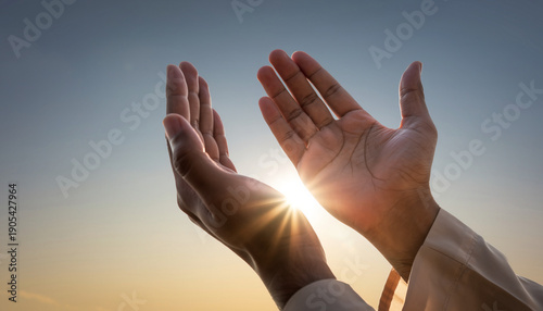 A moment of deep spiritual connection, hands uplifted towards a vibrant sky as the sun's rays inspire hope and devotion, symbolizing faith and gratitude