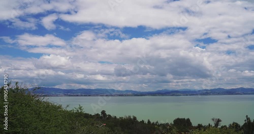 Alpine Lake with Mountains and Moving Clouds