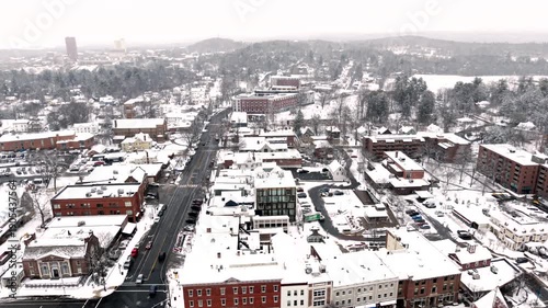 Snow-covered Town Buildings With Town Hall And Episcopal Church In Winter In Amherst, Massachusetts. - aerial pullback shot