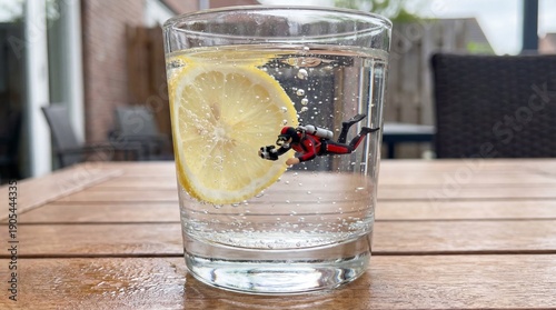 Miniature Scuba Diver in Glass of Lemon Water