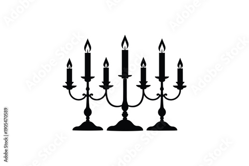 Black silhouette of candelabra with seven lit candles on white background, vintage decoration