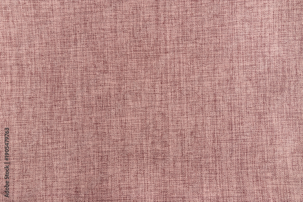 Fototapeta premium Pink fabric texture background. Macro shot of soft pink linen cloth material. Detailed textile weave pattern for fashion, interior design, or craft backdrop.