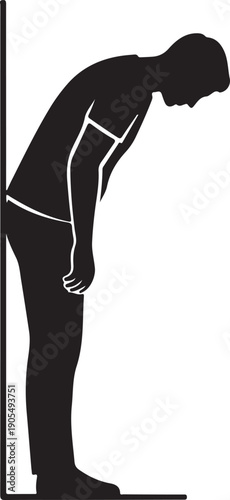 Black silhouette of man leaning on wall exhausted