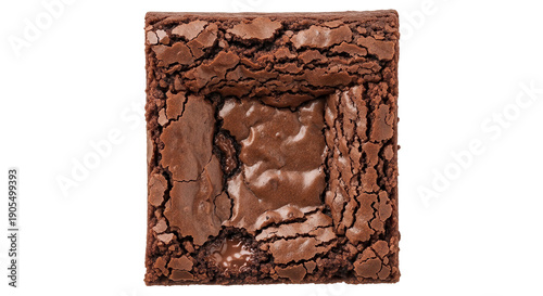 A close-up view of a cracked and broken chocolate brownie on a black background