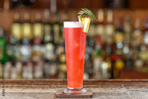 Tableau sur toile Cocktail singapore sling on a background of a bar rack