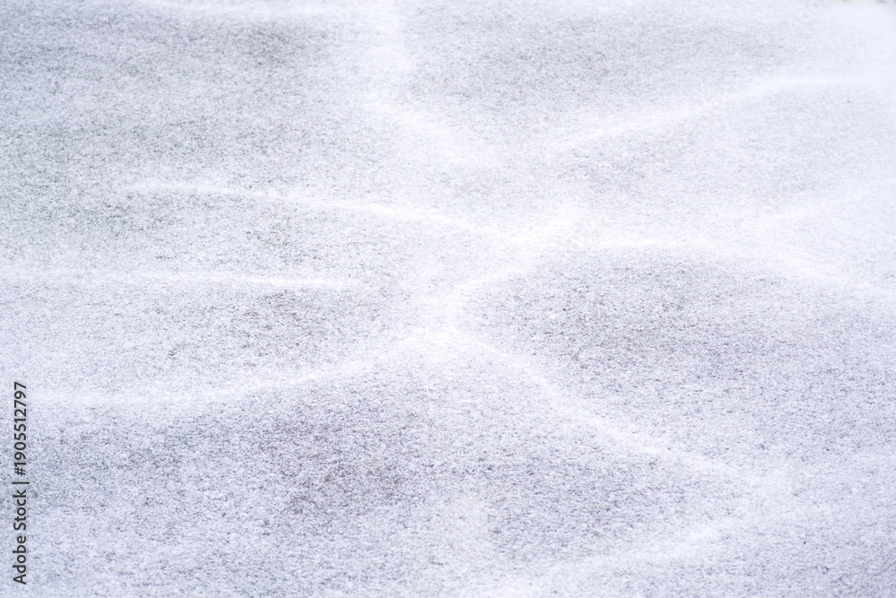 Obraz premium アスファルトにうっすら積もった雪のテクスチャ