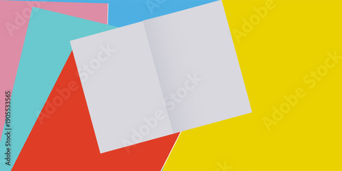 Open notebook and colorful notebooks on blue and yellow background.