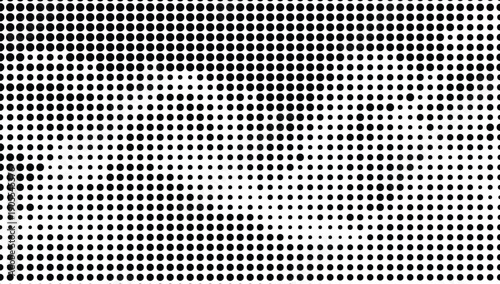 Abstract black and white pattern featuring a gradient of circular dots