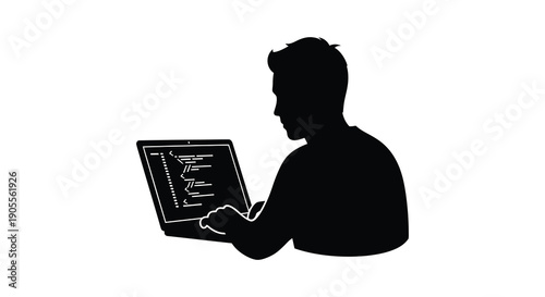 A man working on a laptop depicted as a dark striking silhouette
