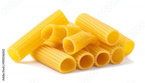 Stack of yellow, ridged, cylindrical pasta tubes against a white background, casting soft shadows