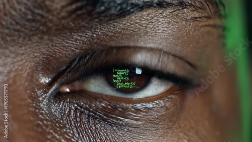 Close-up of a programmer's eye reflecting a screen full of scrolling green JavaScript code.