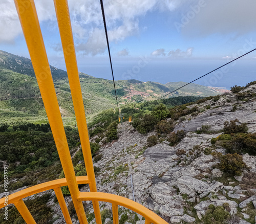 A chairlift ride up the mountains. Views of the sea and mountains from above.