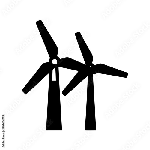 Two wind turbines with blades turning generating renewable energy in black