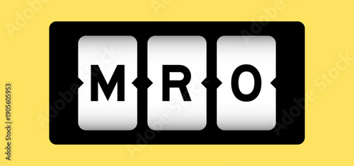 Black color in word MRO (Abbreviation of Maintenance, repair and overhaul or Maintenance, Repair and Operations) on slot banner with yellow color background