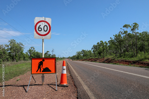 Fotografi Road works sign, reduce speed and traffic cone, speed limit 60 km/h, Stuart Highway, near Darwin, Northern Territory, Australia