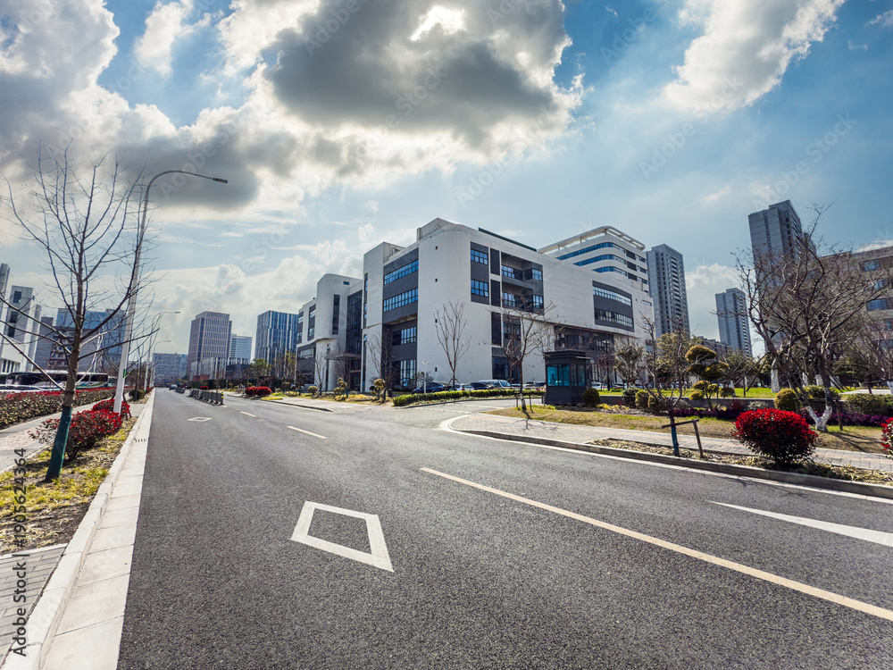 Fototapeta premium Captivating Urban Landscape Featuring Modern Architecture and Lush Green Pathways