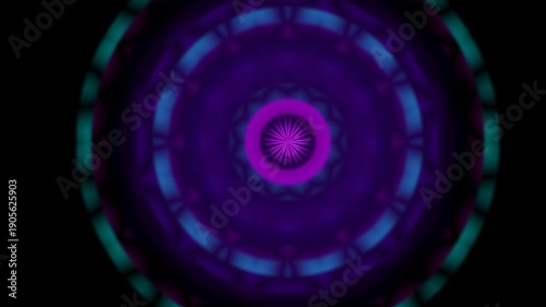 Concentric circular pattern with vibrant purple and teal hues on a dark background