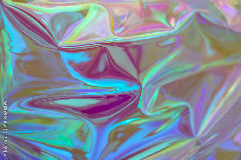 Fototapeta premium Iridescent holographic texture with colorful, reflective waves and dreamlike light for artistic projects