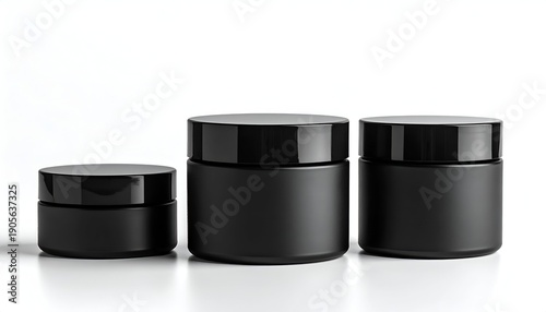 Three matte black jars with screw-on lids, varying sizes on a white surface