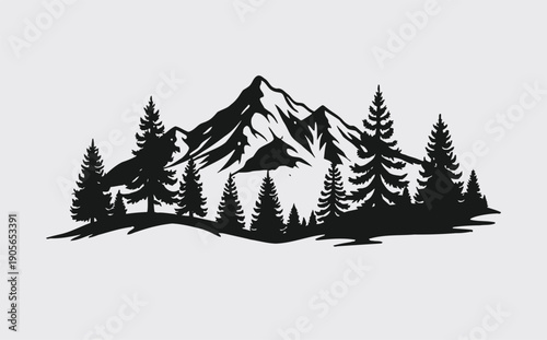 Mountain landscape with pine trees and snow capped peaks