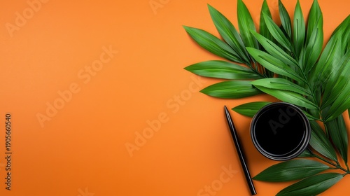 Vibrant Green Tropical Leaves and Black Pen on Burnt Orange