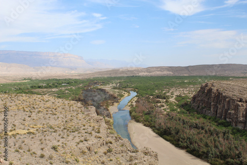 Nearly dry Rio Grande River with mist in the background at Big Bend National Park in Texas
