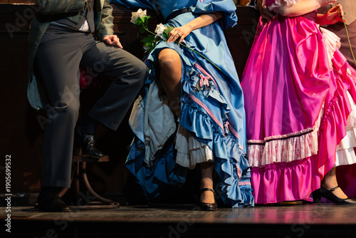 Fotografie Actors in Vintage Costumes Performing a Cabaret or Period Dance on Stage