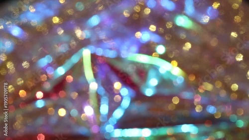 Shimmering bokeh lights, shimmering with vibrant colors, create an abstract and festive background.