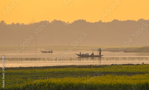 A serene landscape of a boat on a body of water during sunset