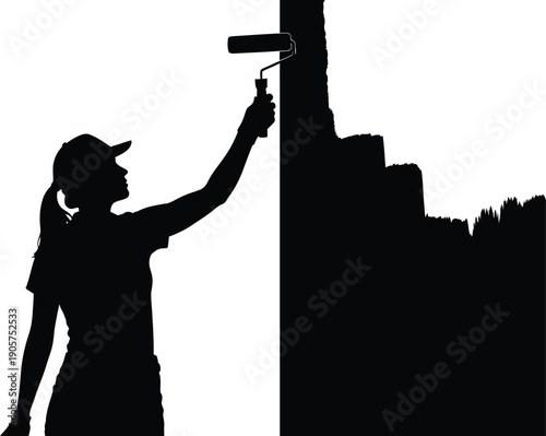 Painter silhouette uses a roller to apply a fresh coat of paint onto a large flat surface area.