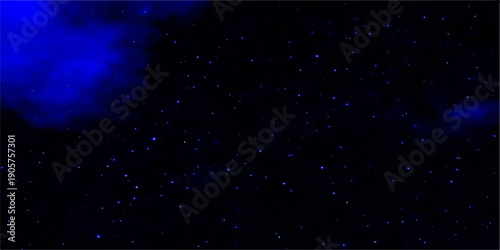 A luminous galaxy of blue stars and cosmic particles glows in the dark night sky of a starry universe nebula