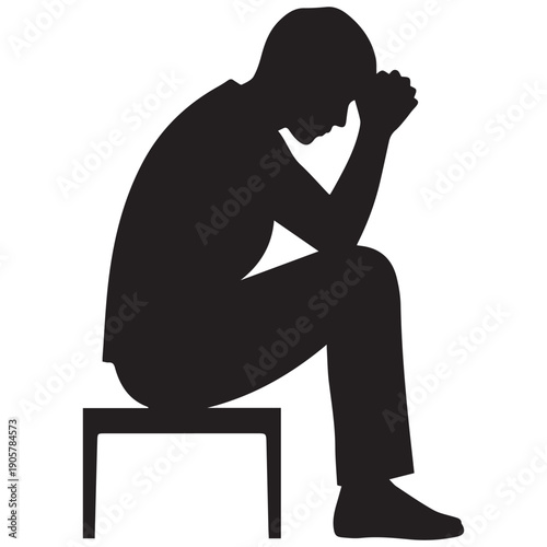 Man sitting alone in contemplation with hand on face