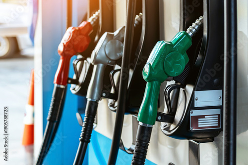 Petrol fuel nozzle for fuelling in petrol fuel station. Hand refilling car with fuel at gas station. Nozzle pump petroleum fuel. Fuel dispensing pump. Fuel and Business service energy concept.