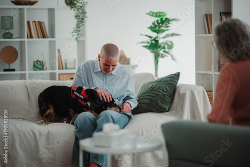 Wallpaper Mural Emotional support dog comforting person during therapy session Torontodigital.ca