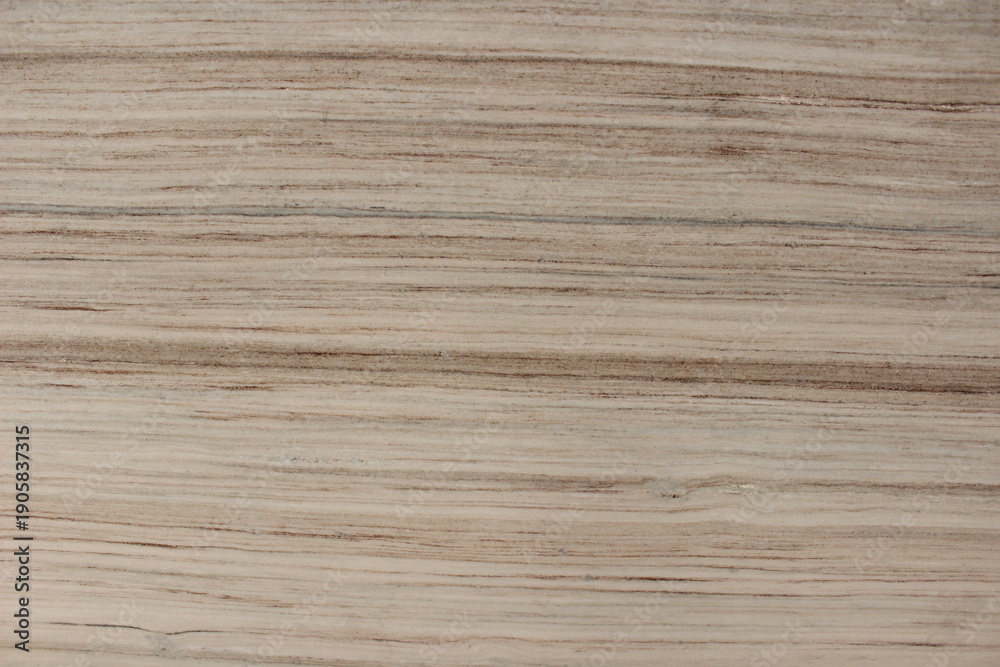 Fototapeta premium Detail of beige Serpeggiante wooden marble texture featuring dense and consistent natural line patterns.