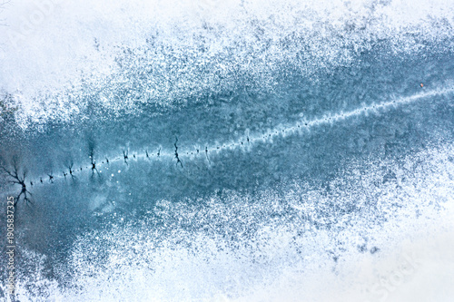 Pressure ridge formation on top of frozen lake
