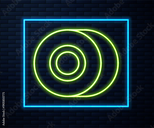 Glowing neon line Skateboard wheel icon isolated on brick wall background. Skate wheel. Vector