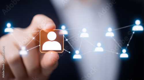 Finger selecting a user icon in a connected network representing recruitment and talent sourcing.
