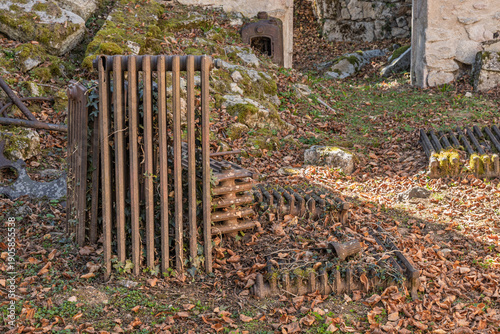 Photography Rusted radiators in destroyed and martyred village Oradour sur Glane in France, a massacre in june 1944 during the scecond world war