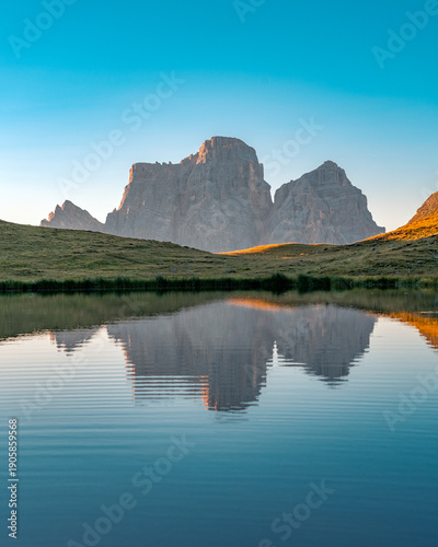 Monte Pelmo reflected on calm Lago delle Baste in Mondeval, Dolomites, Italy